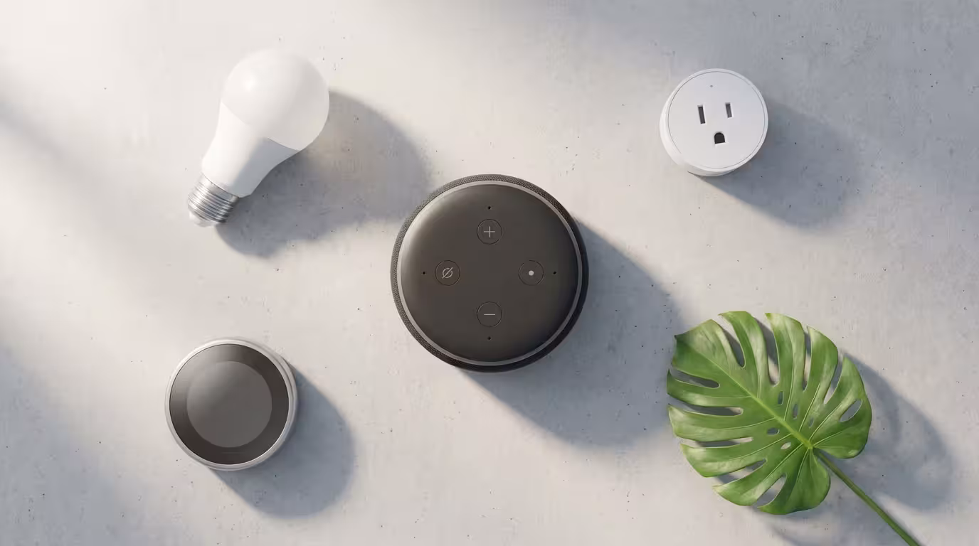 Flat lay of a smart speaker with a smart bulb, plug, and thermostat.
